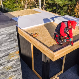 construction-work-on-a-flat-roof-structure-near-tr-2025-12-17-17-06-36-utc